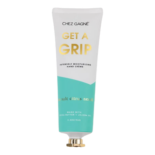 Get A Grip hand cream in sea salt citrus neroli scent with cocoa butter and jojoba oil, packaged in recyclable tube with gold cap