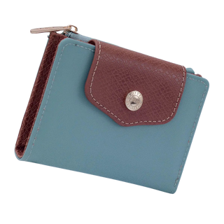 A small zip-around wallet in light blue and brown faux leather with a silver snap button and zipper pull.