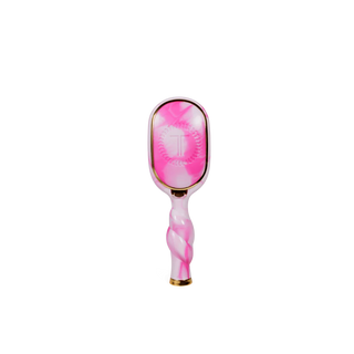 Pink and white hairbrush with gold accents on a white background