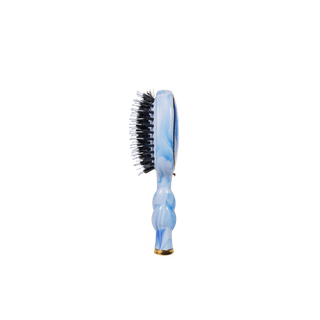 Hairbrush with blue and white marbled handle on a white background