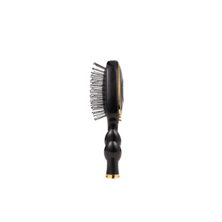 Black hairbrush with gold accents on a white background