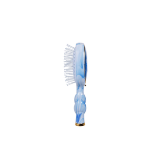 Marbled blue and white hairbrush on a white background