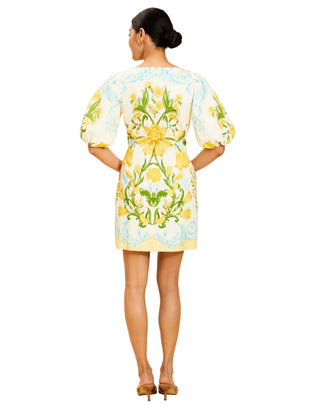 Woman wearing a floral dress with a beige background