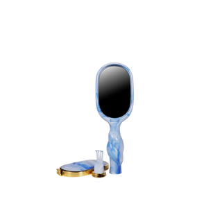 Handheld mirror with blue and white marbled design on a white background