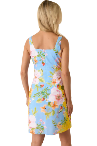 Woman wearing a floral dress with a blue background