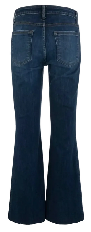 Back view of dark blue denim flare jeans on a white background.