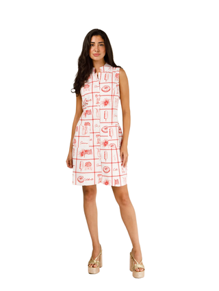 Woman wearing a white dress with red patterns on a white background