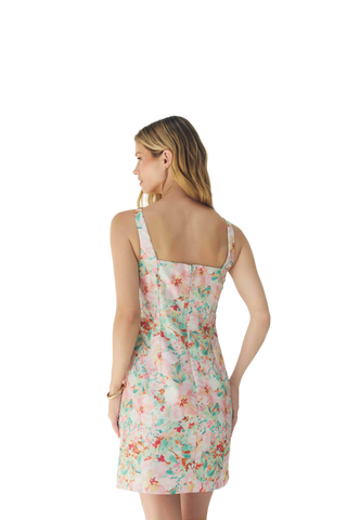 Woman wearing a floral dress on a white background