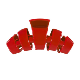 Red hair clip on a white background