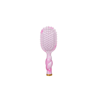 Pink and gold hairbrush on a white background